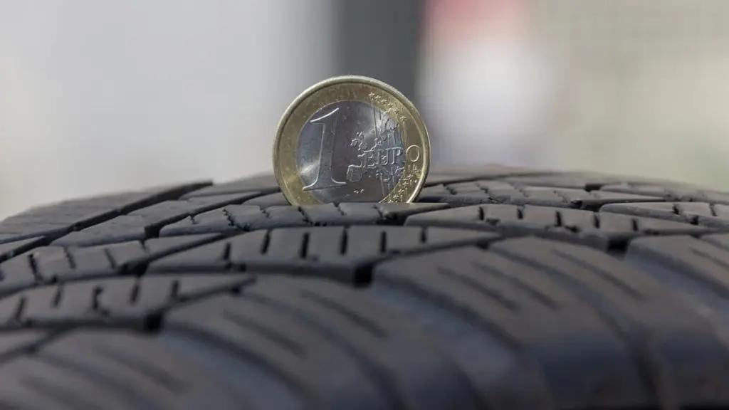 Coin measuring tread depth